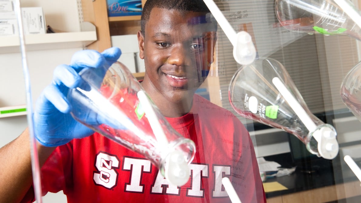 Student working with glassware in lab