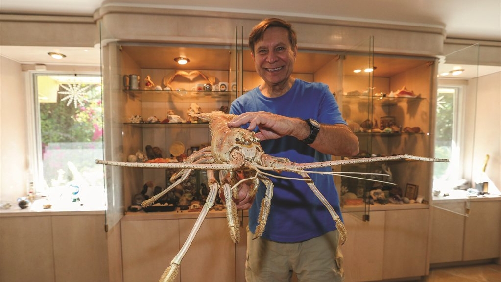 Stephen Leatherman holds a spiny lobster.