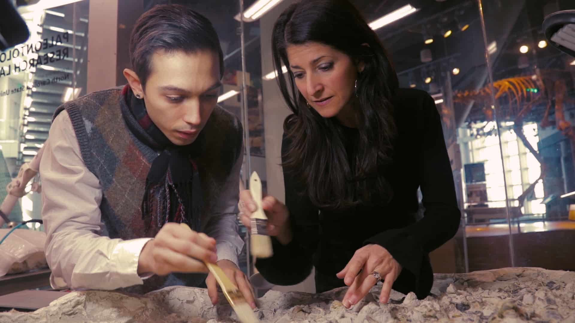 Paleontologist Lindsay Zanno works with a student in her lab