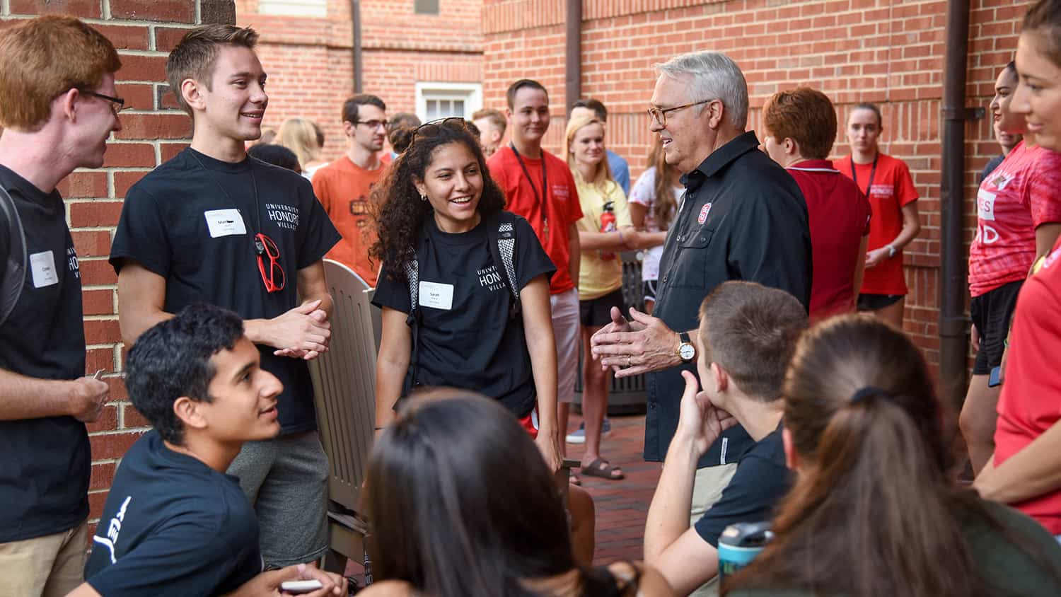 Chancellor Randy Woodson talks with NC State students during move-in