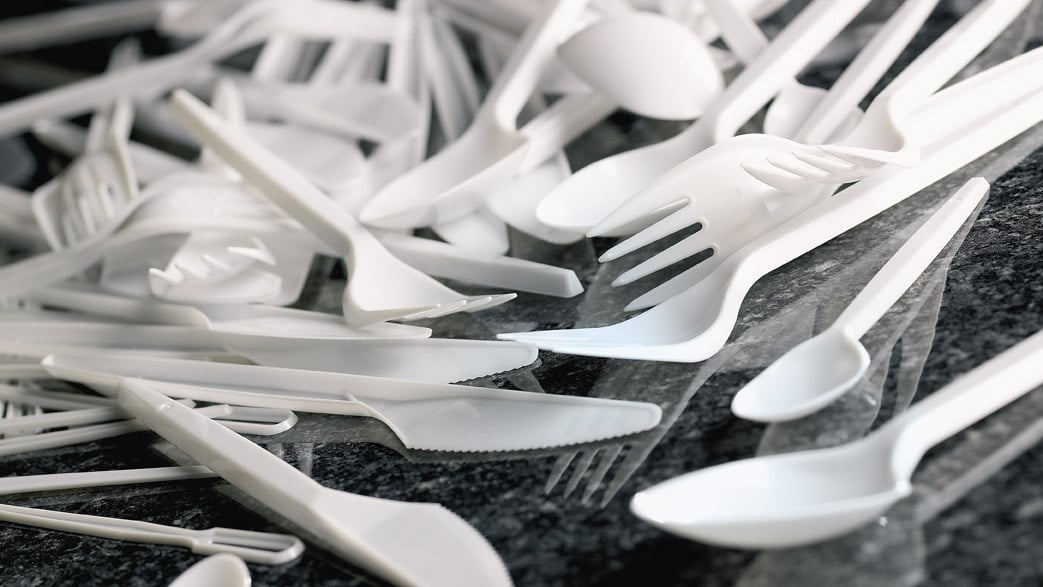 Disposable plastic utensils on a countertop