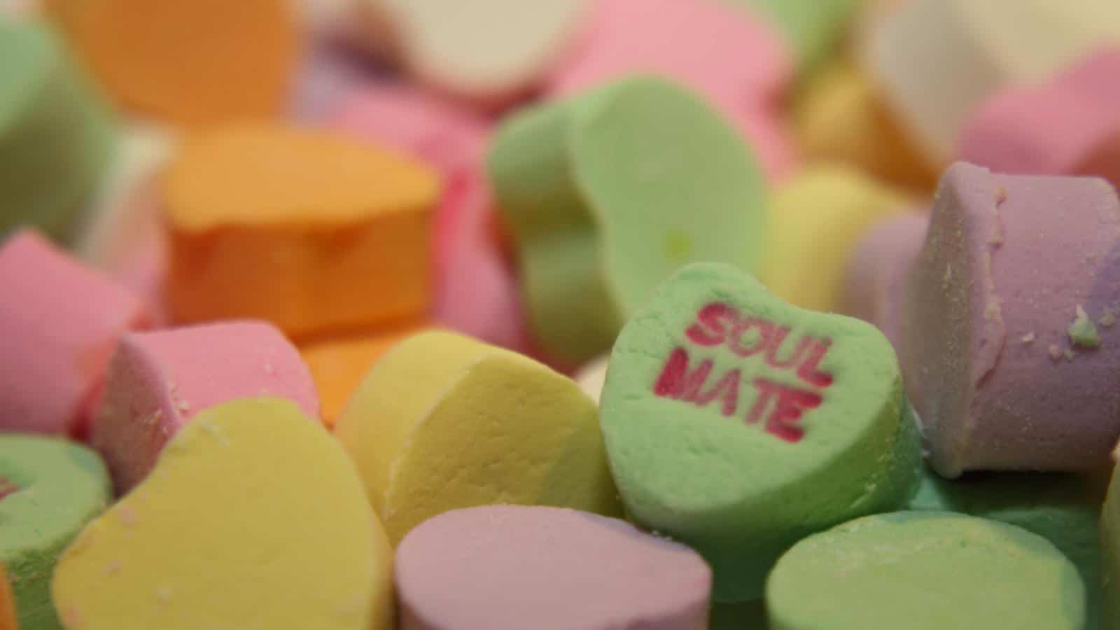 Candy hearts with one reading Soul Mate at the forefront