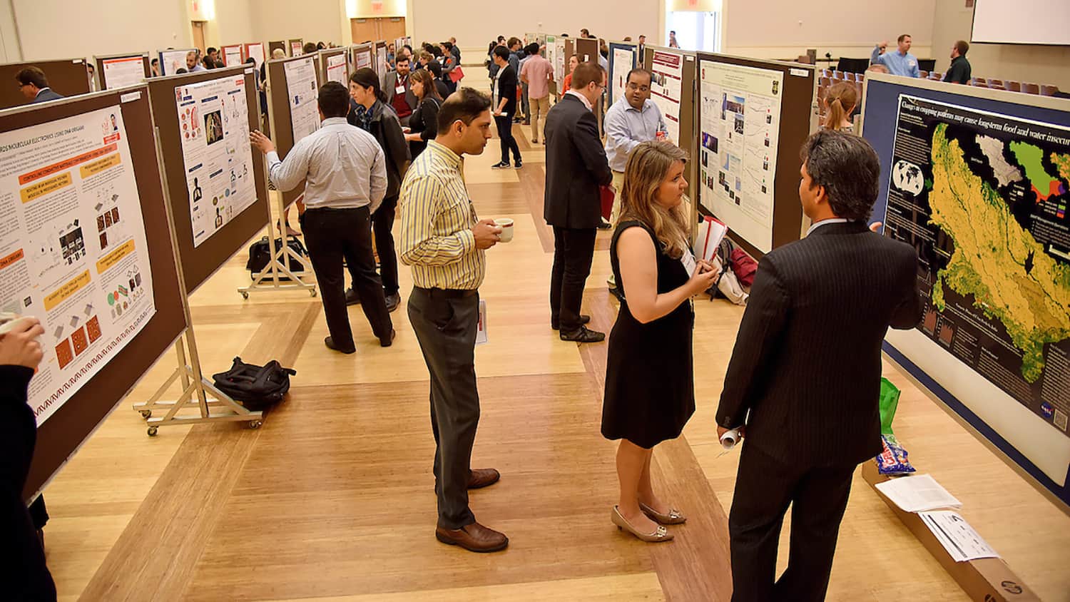 Students and attendees at a research symposium on campus