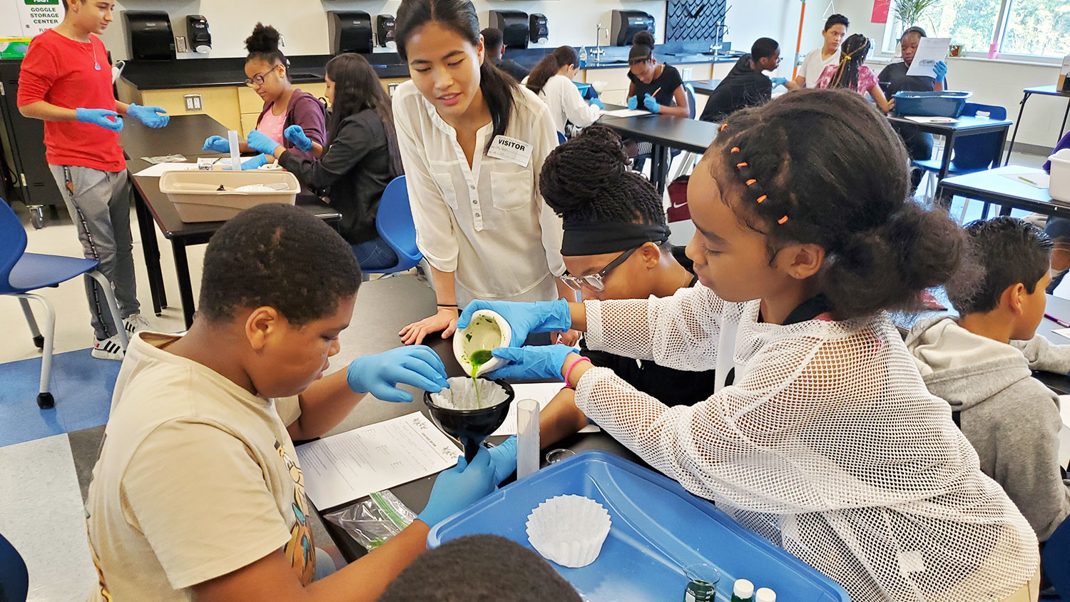 Students conduct an experiment
