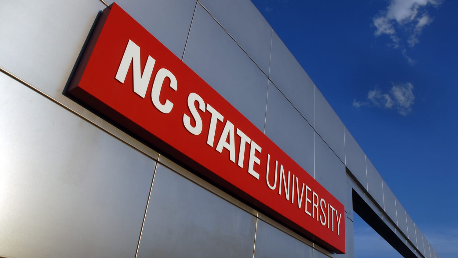 Campus gateway sign that reads NC State University