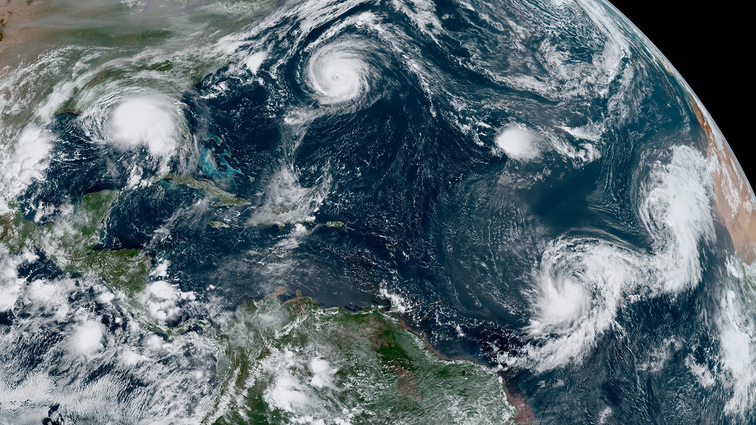 A satellite image of the North Atlantic with 5 active hurricanes on September 14.