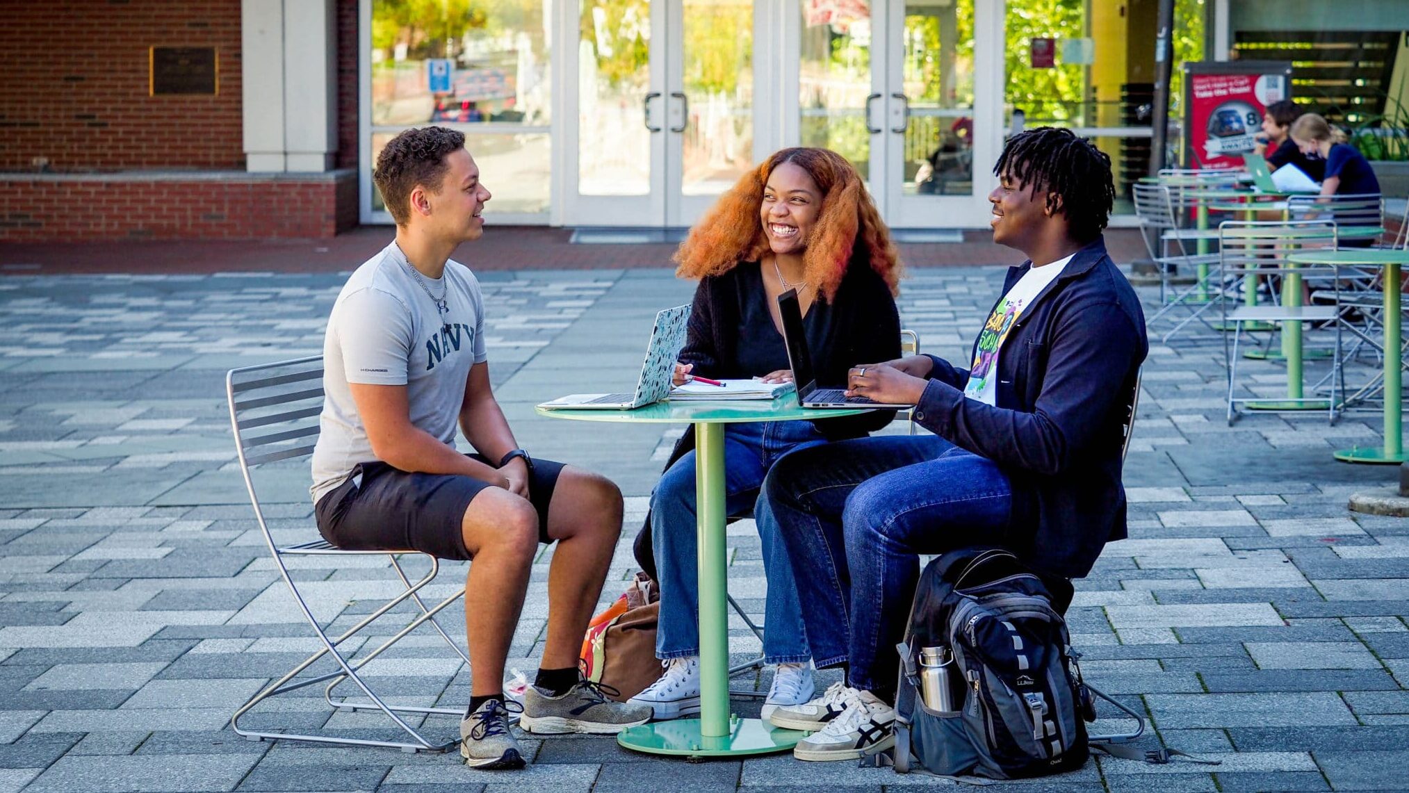 Students talk outside SAS Hall