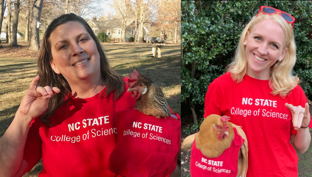 Jamie Barber and Tina Morrison pose with their pet hens, which are dressed up in NC State College of Sciences t-shirts.