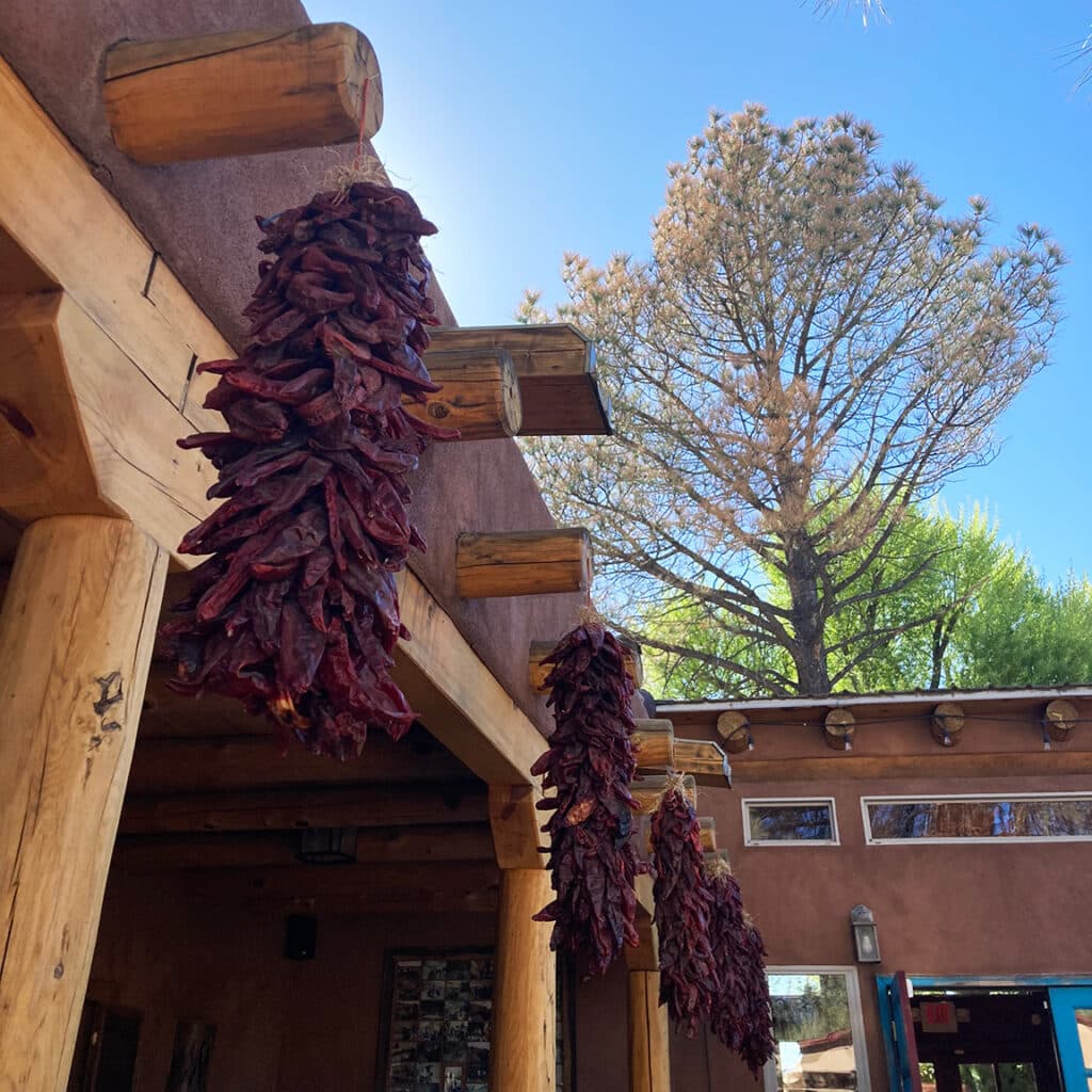 Dried chilis hanging over a patio outside a restaurant in New Mexico.