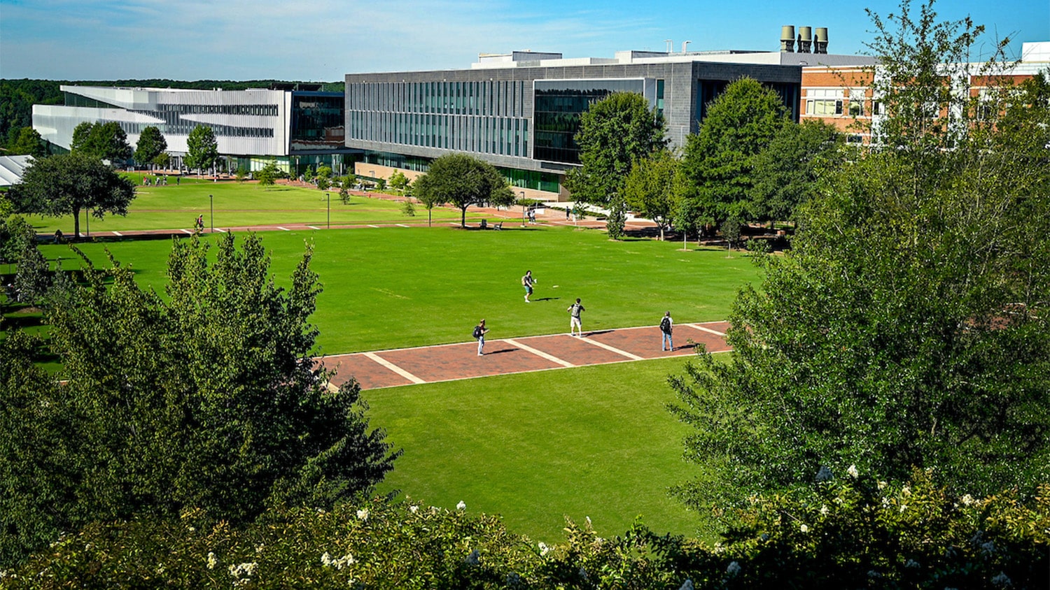 View through the trees of Centennial Campus