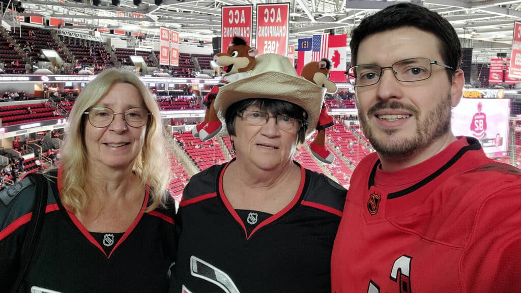 Corey Davis at a Carolina Hurricanes game with his mother and aunt