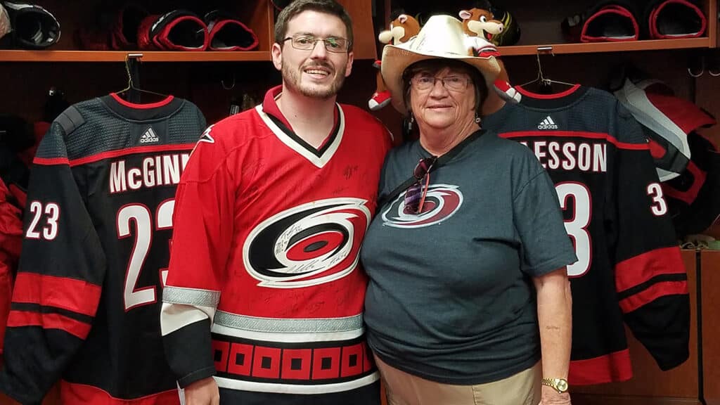 Corey Davis and his mother in the Carolina Hurricanes locker room at PNC Arena.