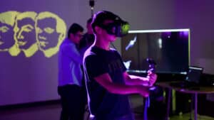 A boy wears a virtual reality headset.