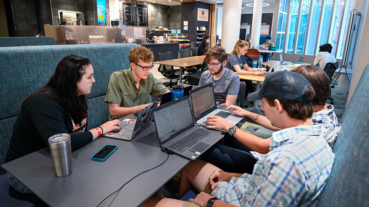 A group of students study at a the Natural Resources Library
