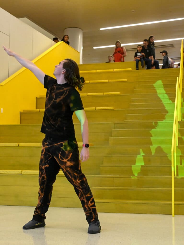 A performer presents an original choreographed piece at the 2023 State of the Sciences event
