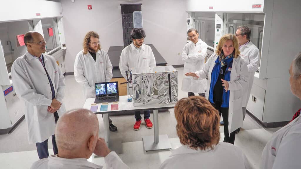 Heike Sederoff, professor of plant and microbial biology, and other members of the research team share with members of the administration about their work in the new ORaCEL lab.
