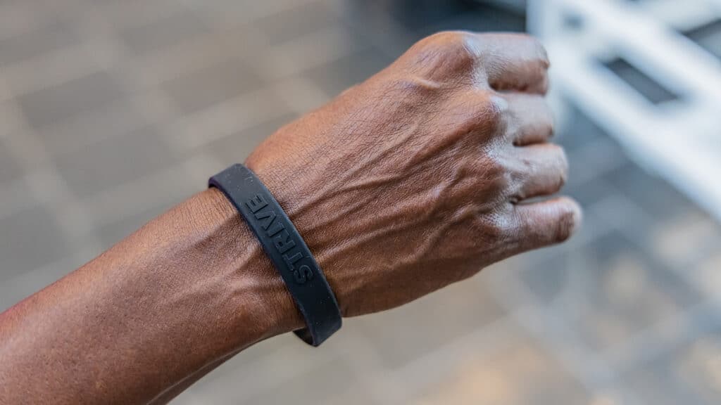 A closeup of wristband on a person's hand