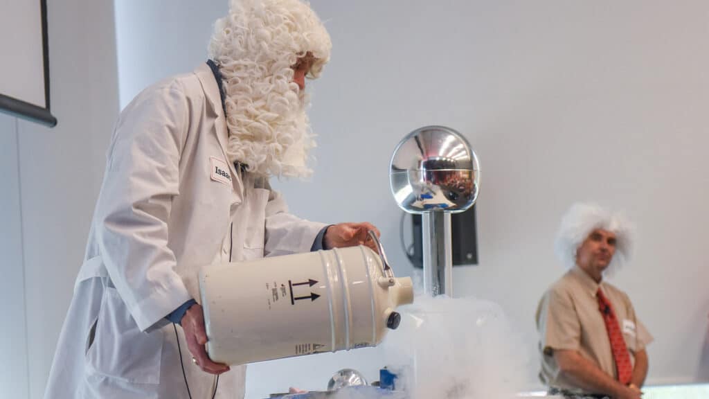 A man dressed up as Isaac Newton gives a science demonstration at the 2017 State of the Sciences event
