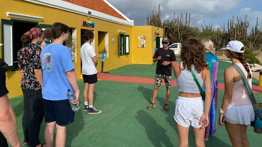 MEAS students tour a museum in Bonaire as part of a summer immersive science diving program