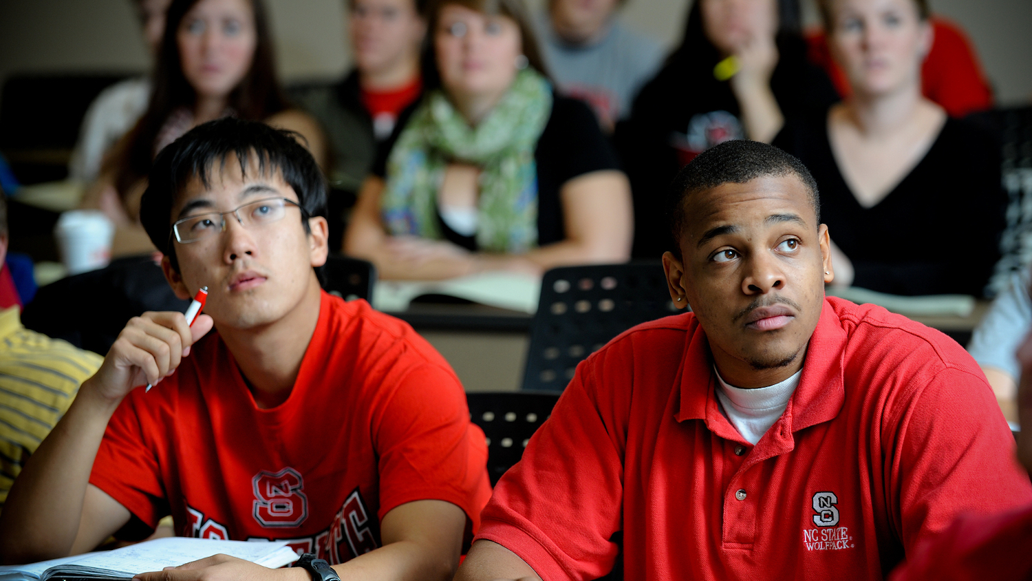 students in classroom taking notes