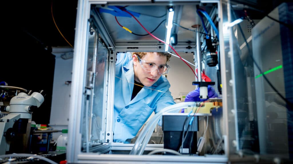 Adam Nahor at work in David Muddiman's chemistry lab