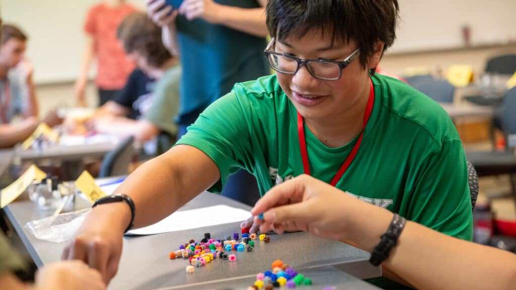 A student participates in a hands-on science activity