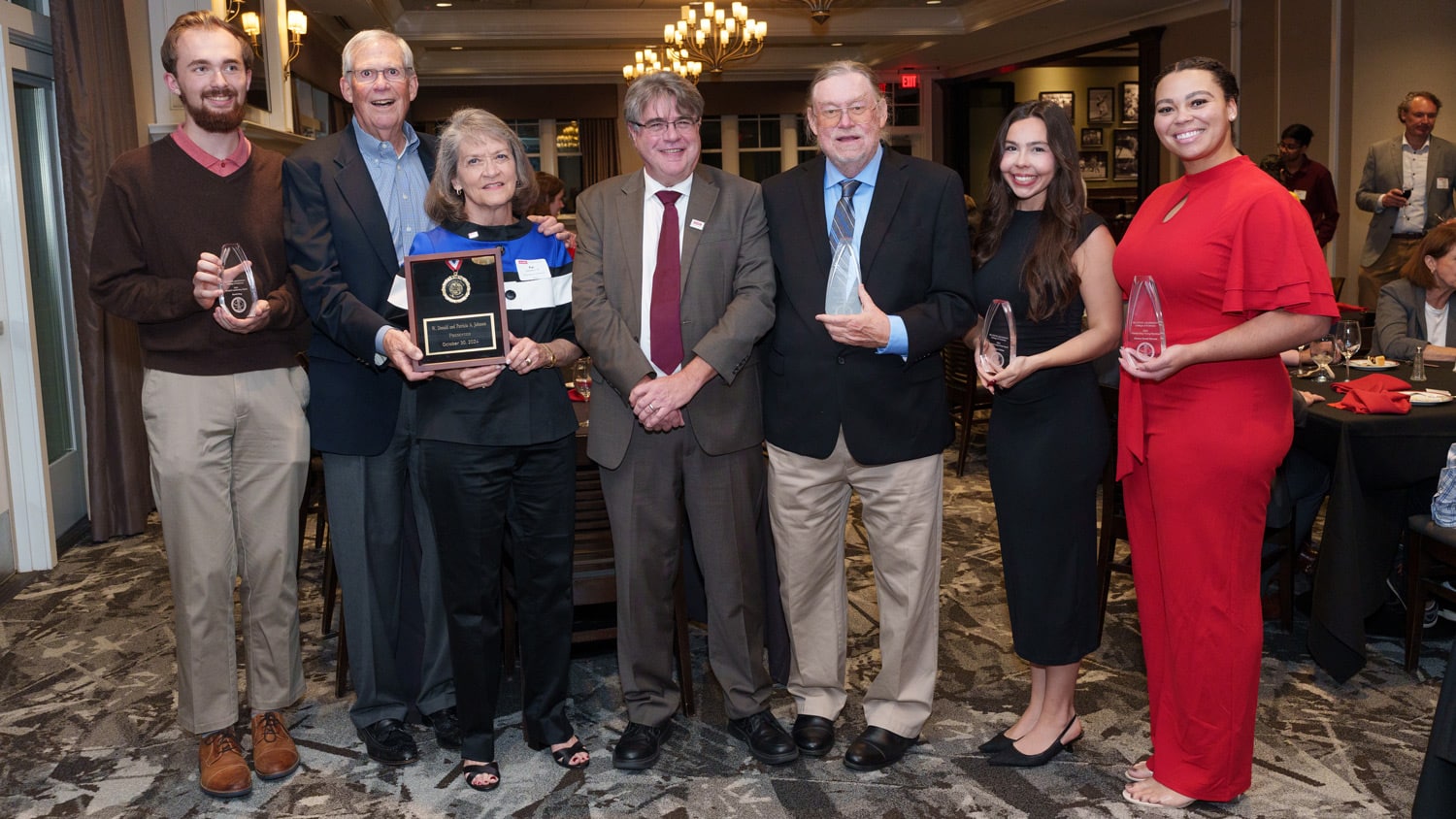 Dean Lewis Owen poses with the six award recipients at the College of Sciences' 2024 annual awards dinner.