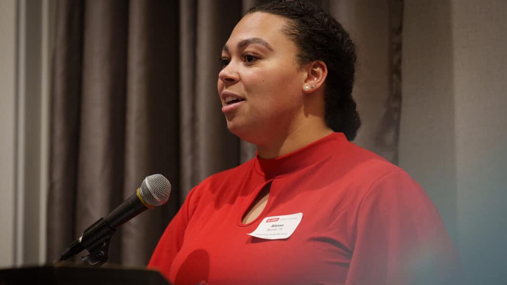 Alumna Alease Barnes speaking to the crowd at the College of Sciences' 2024 annual awards dinner.