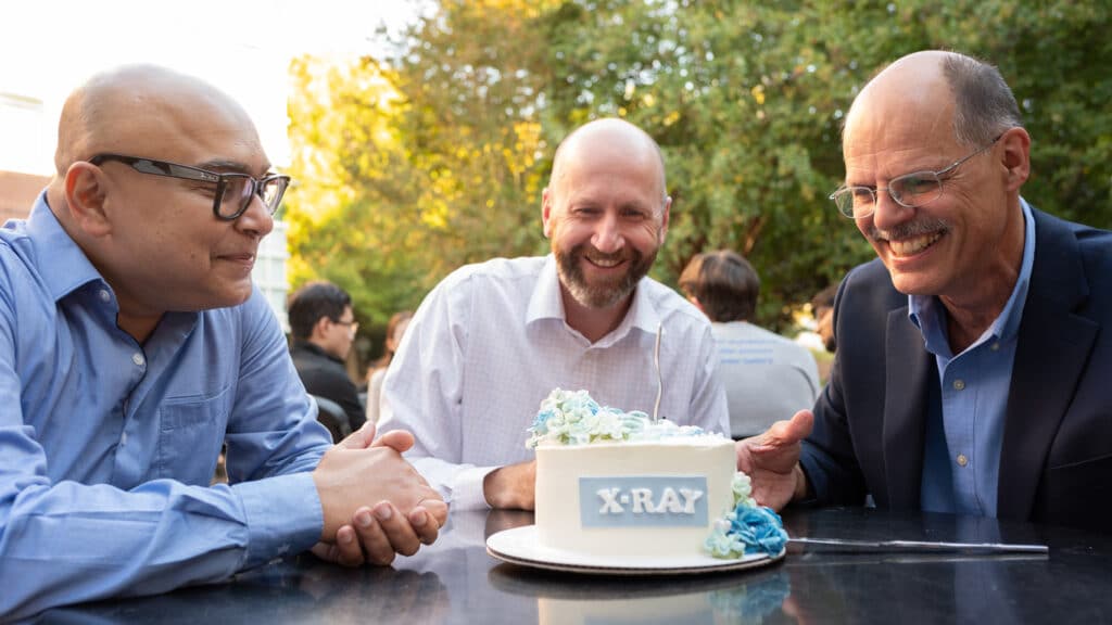 Subhrangsu Mukherje and Harald Ade cut into a cake at the Xeuss 3.0 inauguration ceremony