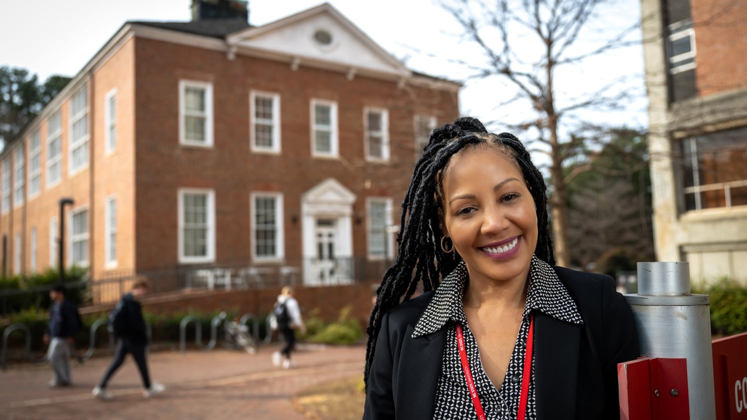 Nicole Johnson, the embedded counselor for the College of Sciences, stands in front of the Bureau of Mines building
