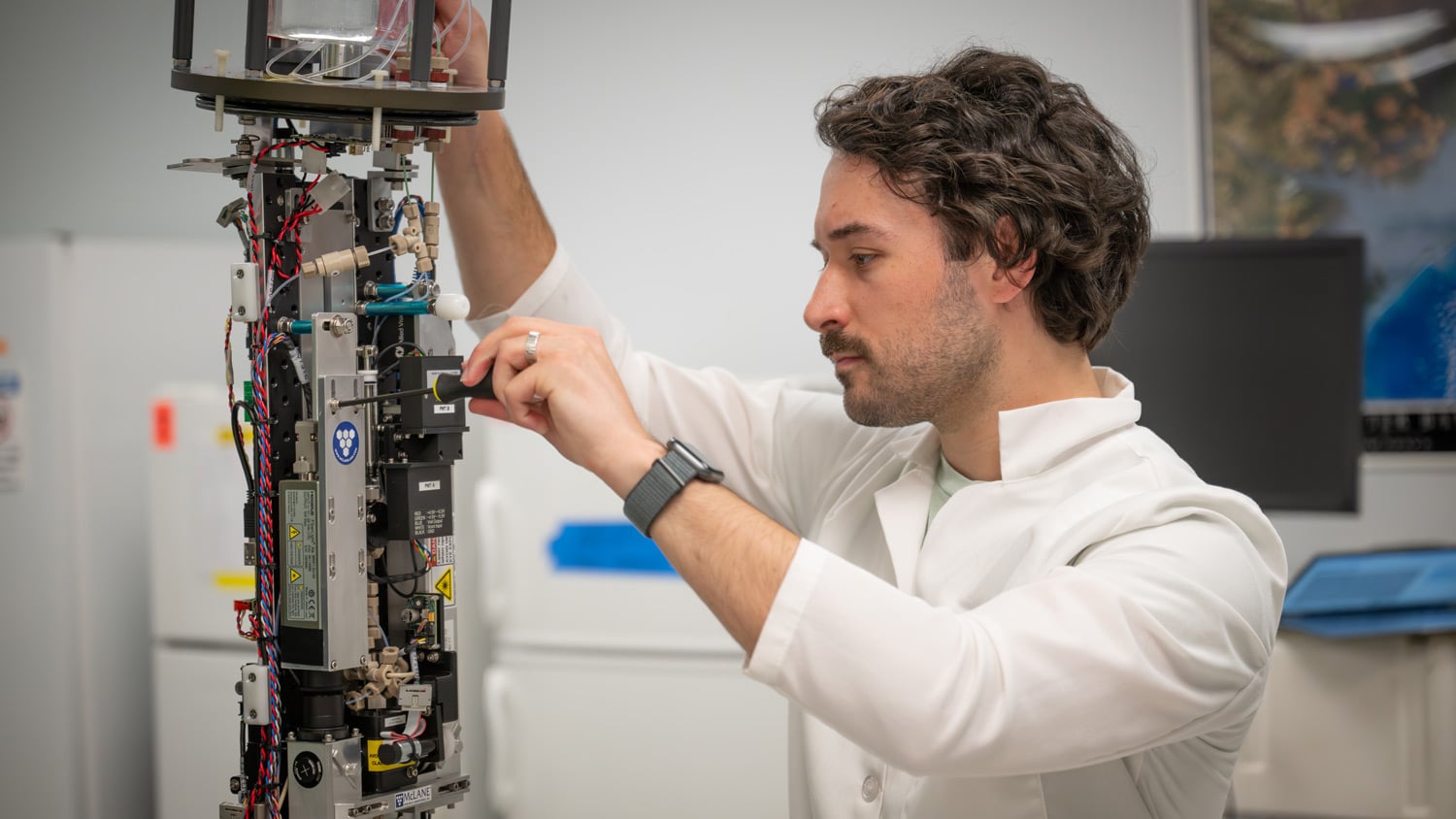 A student from NC State's Department of Marine, Earth and Atmospheric Sciences works in a lab on campus