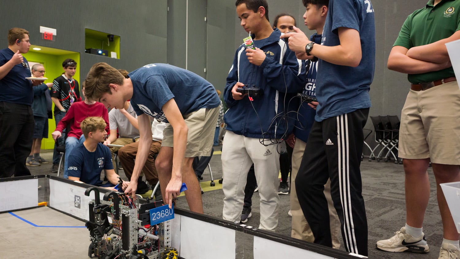 Students from The Science House's Biome Robotics program assemble a robot at the 2025 State of the Sciences event