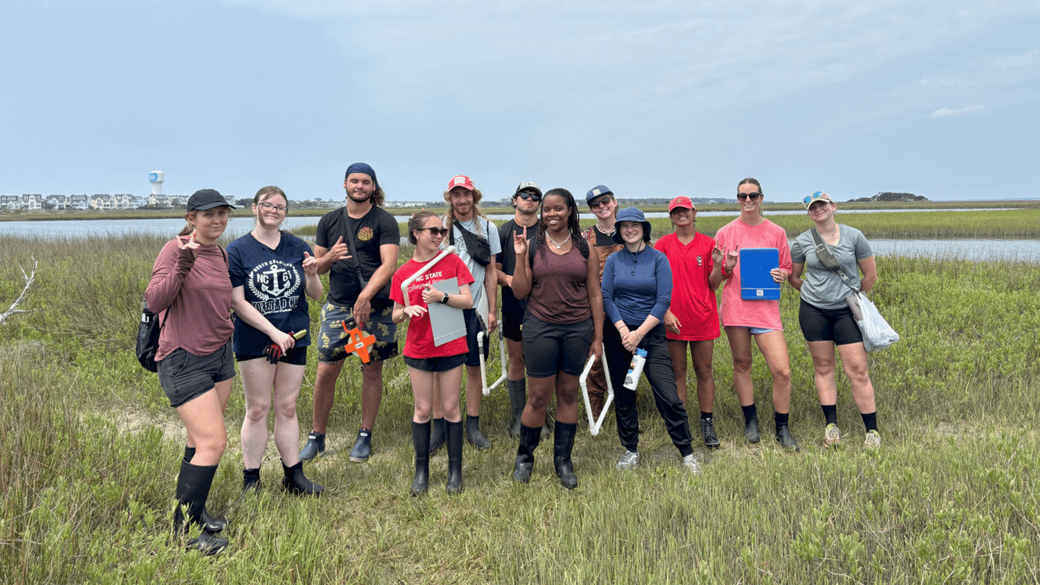 A group of undergraduate students who helped plant a "donor marsh" in Carteret County.