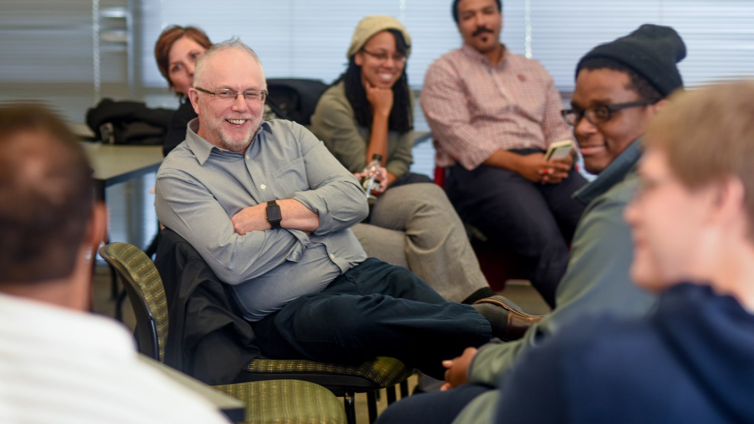 Dean Ditto sitting and talking with students
