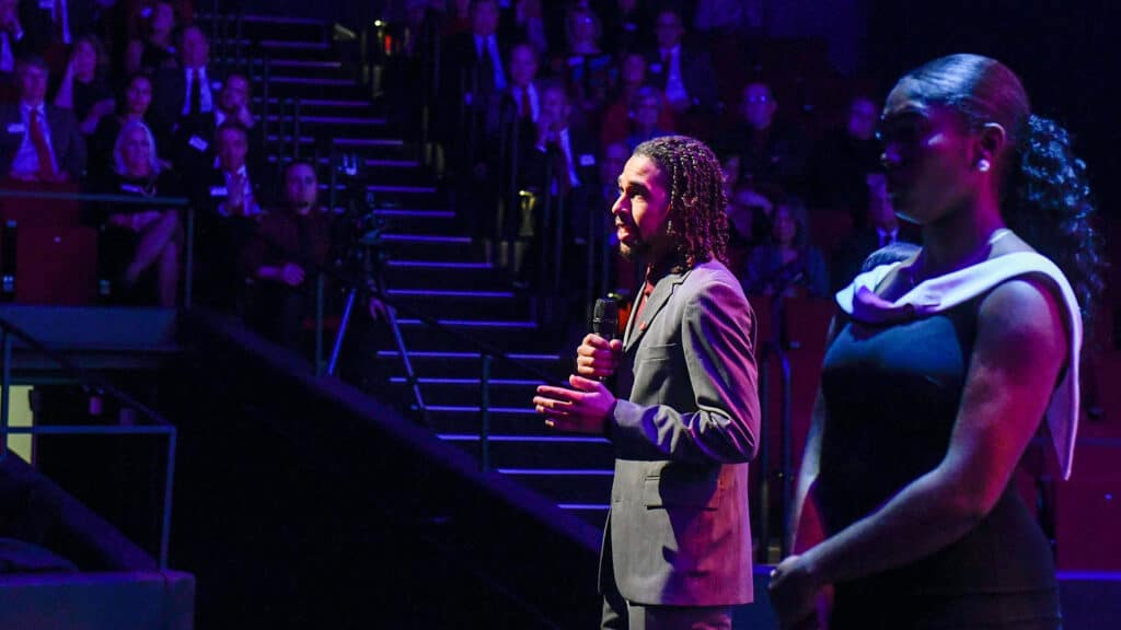 Gino Fernandes speaks in Reynolds Coliseum on Red and White Night 2019.