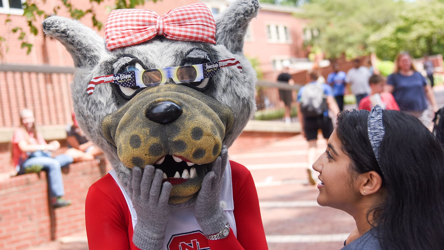 Ms. Wuf tries on her solar glasses on August 21, 2017, for Solar Eclipse Day on the Brickyard.